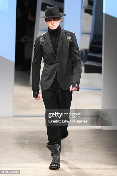 Model walks the runway at the Kenneth Cole Collection fashion show during Mercedes-Benz Fashion Week Fall 2014 at The Garage at Lincoln Center on...