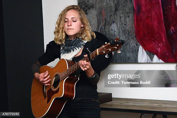 Singer Sonja Midtune performs at the 2015 Art Of Elysium dinner with photographer John Russo on April 22, 2015 in Los Angeles, California.