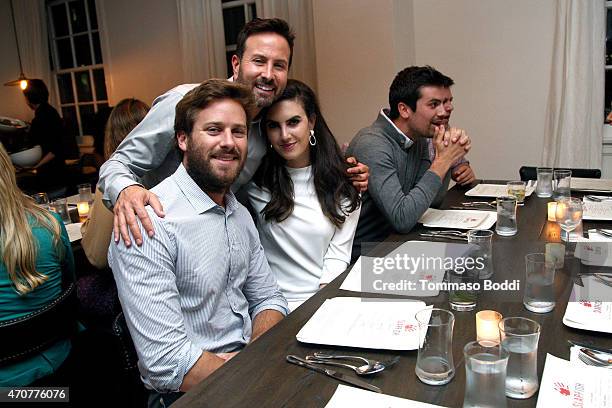 Actor Armie Hammer, photographer John Russo and model Elizabeth Chambers attend the 2015 Art Of Elysium dinner with photographer John Russo on April...