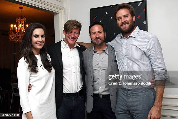 Models Elizabeth Chambers, Travis Milde, Photographer John Russo and actor Armie Hammer attend the 2015 Art Of Elysium dinner with photographer John...