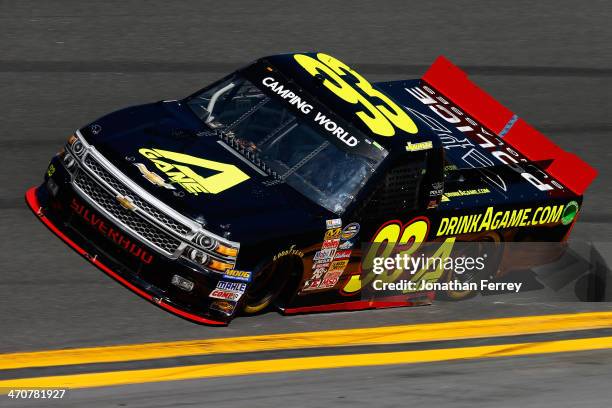 Jason White, driver of the RSS Racing Chevrolet, practices for the NASCAR Camping World Series NextEra Energy Resources 250 at Daytona International...