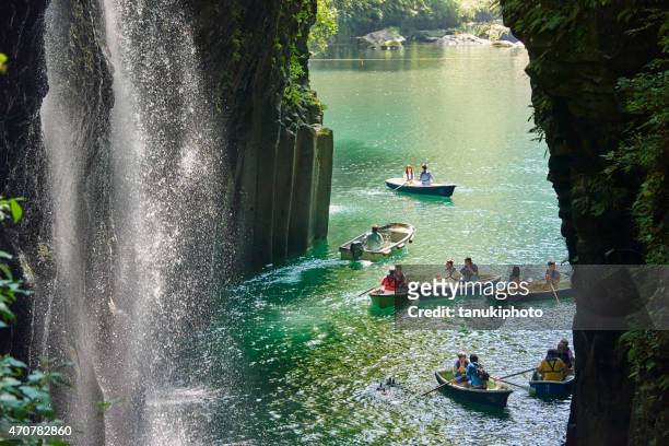 tourists at the takachiho gorge - miyazaki prefecture stock pictures, royalty-free photos & images