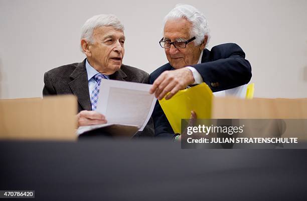 Auschwitz survivors and plaintiffs Max Eisen and William "Bill" Glied chat before the third day of the trial of former Nazi death camp officer Oskar...