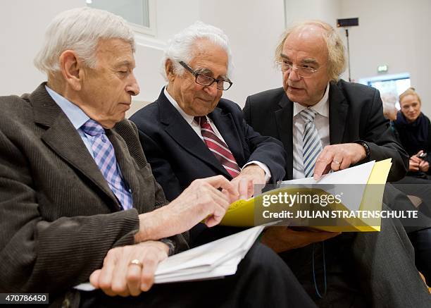 Auschwitz survivors and plaintiffs Max Eisen and William "Bill" Glied chat next to their lawyer Thomas Walther before the third day of the trial of...