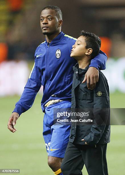 Patrice Evra of Juventus and his son Lenny Evra walk on the pitch after the UEFA Champions League Quarter Final second leg match between AS Monaco FC...