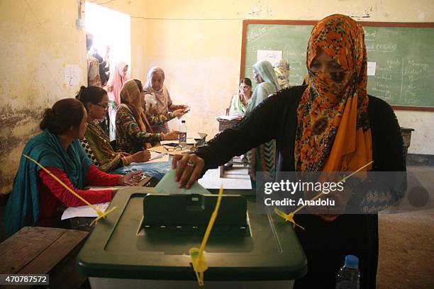 Pakistani woman casts her ballot at a polling station during the by-election in Karachi, Pakistan on April 23, 2015. Pakistan's ruling party agreed...