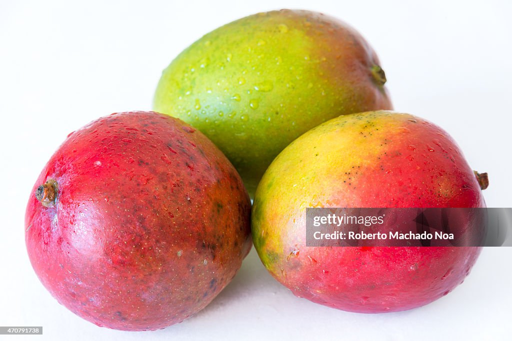 Realistic approach to tropical fruits: three  imperfect ripe...