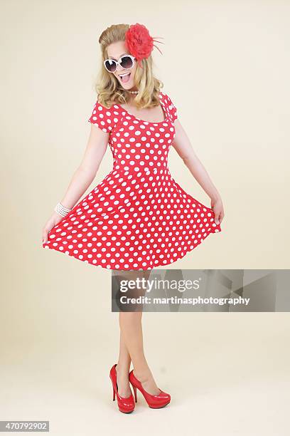 pin-up girl in polka dot dress - 40s pin up girls stock pictures, royalty-free photos & images