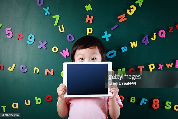 boy with tablet - number magnet stock pictures, royalty-free photos & images