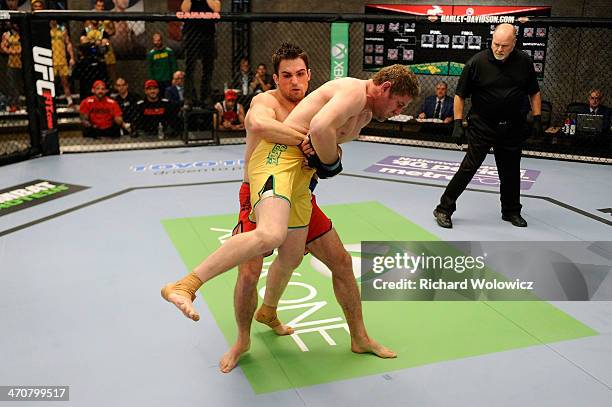 Team Canada fighter Sheldon Westcott takes down Team Australia fighter Daniel Kelly in their middleweight fight during filming of The Ultimate...