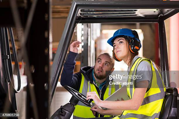 female forklift driver training - factory workers stockfoto's en -beelden