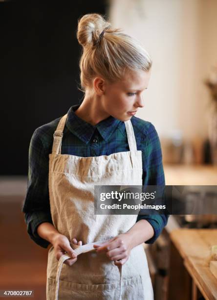 she's ready to make another batch of coffee - apron stockfoto's en -beelden