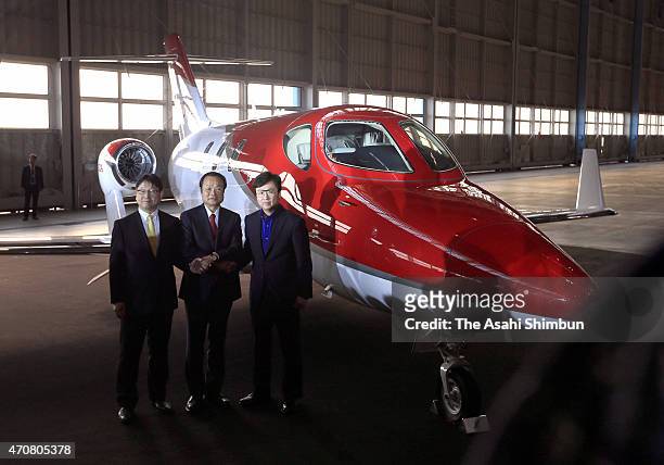 Honda Motor Co Senior Managing Officer Yoshiharu Yamamoto, Honda Motor Co President Takanobu Ito and Honda Aircraft President Michimasa Fujino pose...