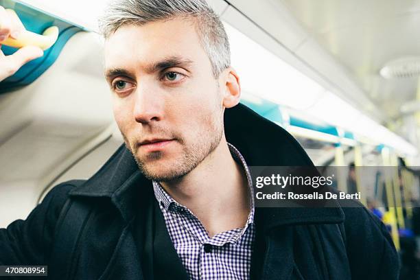 man on the subway train - london underground speed stockfoto's en -beelden