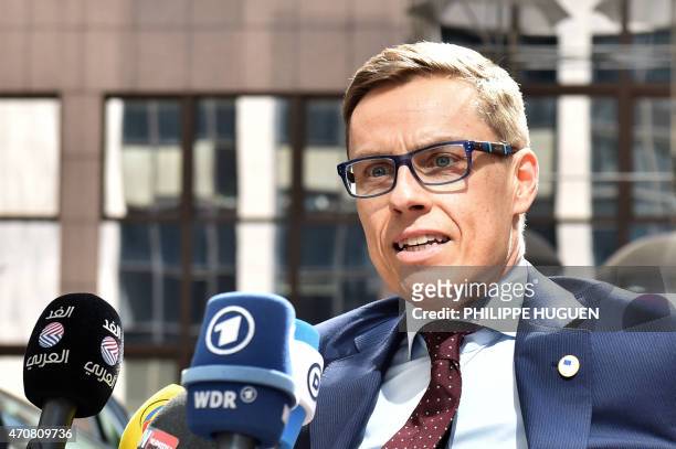 Finland's Prime minister Alexander Stubb addresses reporters upon his arrival at the European Council headquarters for an extraordinary summit of...