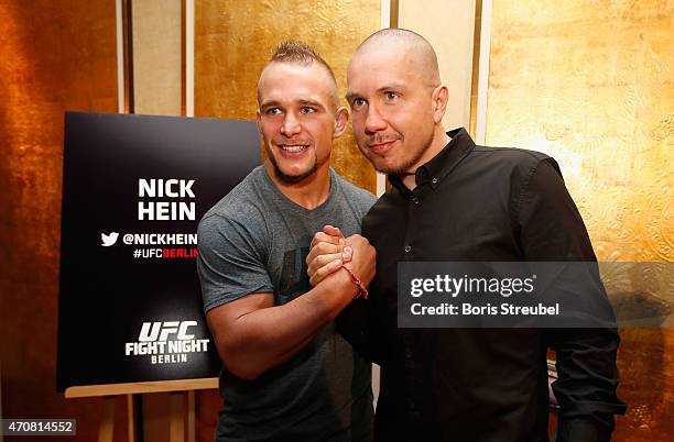 Nick Hein of Germany poses with DJ Tommek during the UFC press conference at O2 World on April 23, 2015 in Berlin, Germany.