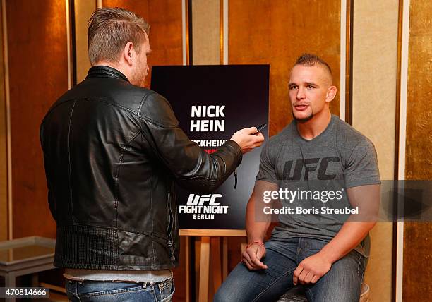 Nick Hein of Germany interacts with the media during the UFC press conference at O2 World on April 23, 2015 in Berlin, Germany.