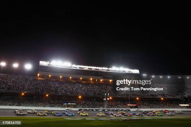 Austin Dillon, driver of the DOW Chevrolet, and Greg Biffle, driver of the 3M Ford, lead the field at the start of the NASCAR Sprint Cup Series...