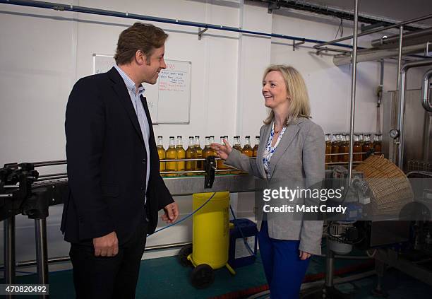 Conservative parliamentary candidate Marcus Fysh speaks with Conservative MP and Secretary of State for Environment Liz Truss at Perry's Cider millas...