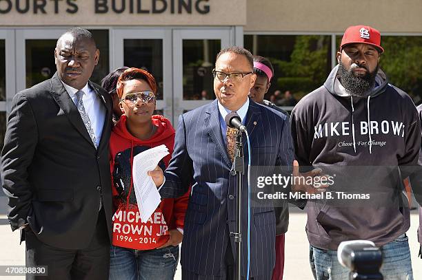 Brown family attorney, Benjamin L. Crump speaks to the media along with Lesley McSpadden and Michael Brown Sr. During a press conference outside the...