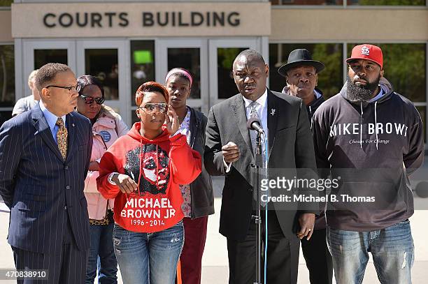 Brown family attorney, Benjamin L. Crump speaks to the media along with Lesley McSpadden and Michael Brown Sr. During a press conference outside the...
