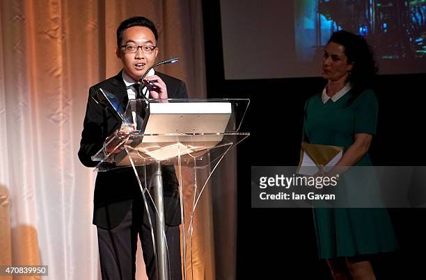 Yong Lin Tan with his Youth award and presenter Francesca Sears, Director of Panos Pictures on stage at the Sony World Photography Awards 2015 held...
