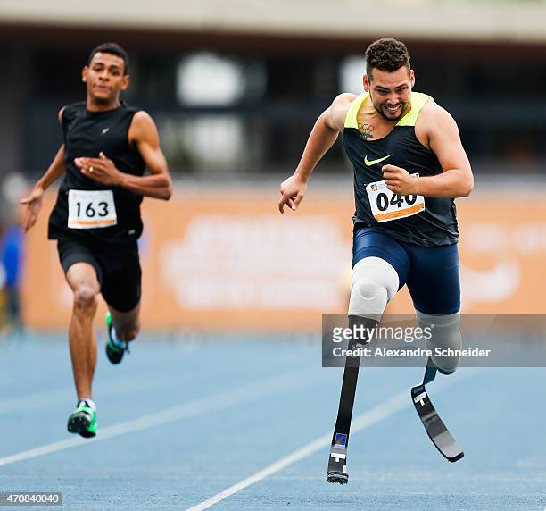 Kesley Teodoro of Brazil and Alan Oliveira of Brazil compete in the Men's 100 meters qualifying at Ibirapuera Sports Complex during day one of the...