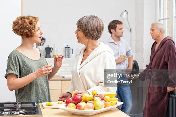 daughter in law seeks advice from mother in law - father in law stock pictures, royalty-free photos & images