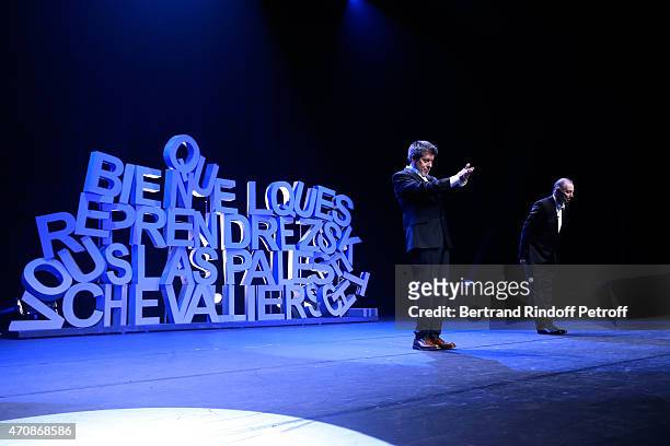 French Humorists Regis Laspales and Philippe Chevallier acknowledge the applause of the audience at the end of their show "Vous reprendrez bien...