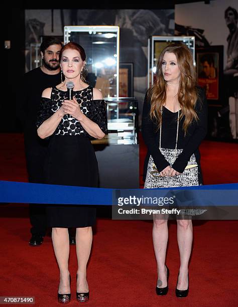Actress Priscilla Presley and Singer Lisa Marie Presley attend the ribbon-cutting ceremony during the grand opening of "Graceland Presents ELVIS: The...