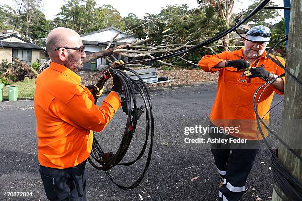 Workers continue the clean up effort in North Avoca on April 24, 2015 in Gosford, Australia. Gosford City and Wyong shire have official been declared...