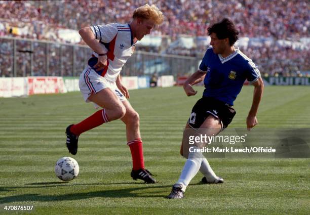June 1990 - Fifa World Cup Quarter Final - Yugoslavia v Argentina - Robert Prosinecki of Yugoslavia tries to dribble past Juan Simon of Argentina.