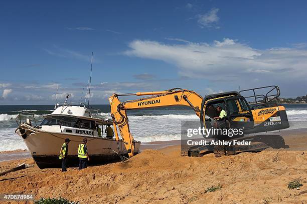 Clean up operations begin on the boat "Impulse" at Wamberal Beach on April 23, 2015 in Gosford, Australia. Gosford City and Wyong shire have official...