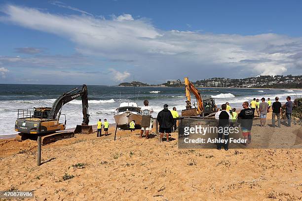 Clean up operations begin on the boat "Impulse" at Wamberal Beach on April 23, 2015 in Gosford, Australia. Gosford City and Wyong shire have official...