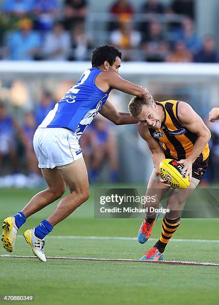 Lindsay Thomas of the Kangaroos tackles Sam Mitchell of the Hawks during the round two AFL NAB Challenge match between the Hawthorn Hawks and the...