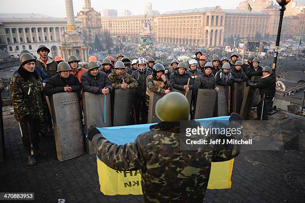 Anti-government protesters man the front line barricades following yesterdays clashes with police in Independence square, on February 21, 2014 in...