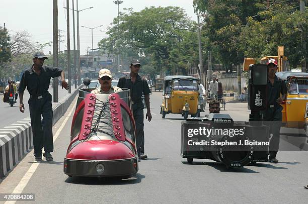 Mr. K. Sudhakar rides a shoe car outside the Sudha Cars Museum. He is a Guinness World Record holder for making the Largest Tricycle in the World. A...