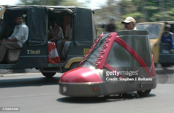Mr. K. Sudhakar rides a shoe car outside the Sudha Cars Museum. He is a Guinness World Record holder for making the Largest Tricycle in the World.