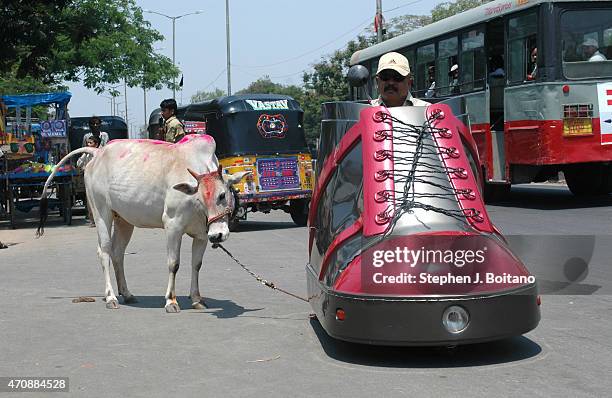 Mr. K. Sudhakar rides a shoe car outside the Sudha Cars Museum. He is a Guinness World Record holder for making the Largest Tricycle in the World.