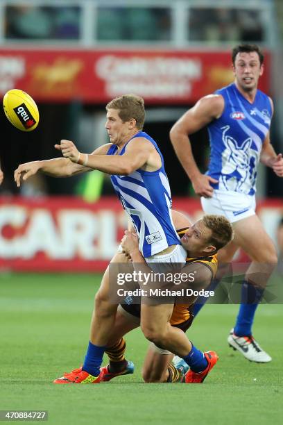Nick Dal Santo of the Kangaroos is tackled by Sam Mitchell of the Hawks during the round two AFL NAB Challenge match between the Hawthorn Hawks and...