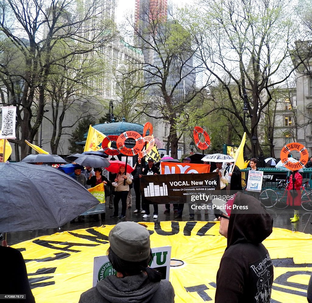 The groups gathered around a huge yellow banner...