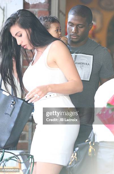 Lilit Avagyan, Reggie Bush and Breseis Bush are seen at the Ivy on February 20, 2014 in Los Angeles, California.