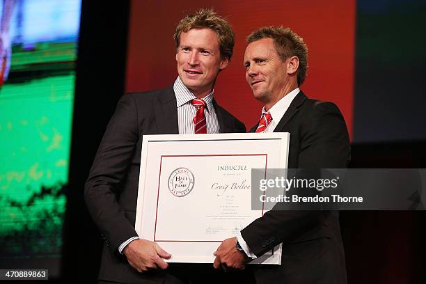 Former Swans player, Craig Bolton receives his Sydney Swans Hall of Fame Induction from former Swans player, Stuart Maxfield during the Sydney Swans...