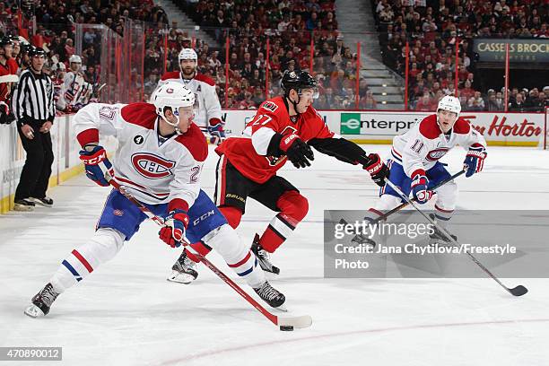 Curtis Lazar of the Ottawa Senators defends against a pass from Alex Galchenyuk of the Montreal Canadiens as Brendan Gallagher of the Montreal...