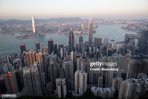 Commercial and residential buildings sit in Hong Kong, China, on Thursday, Feb. 20, 2014. Hong Kong is scheduled to release fourth quarter gross...