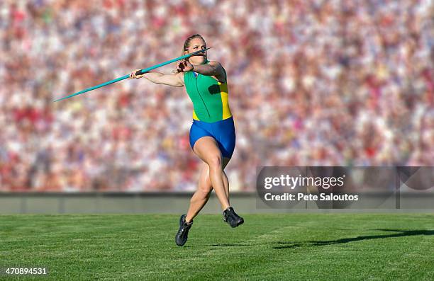 athlete throwing javelin - speer stock-fotos und bilder