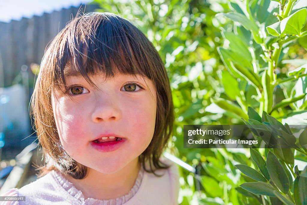 Girl in fava bean garden