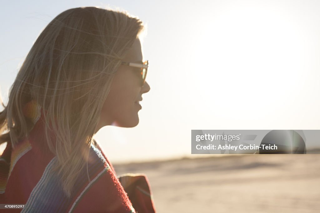 Portrait of young woman wrapped in blanket, Breezy Point, Queens, New York, USA