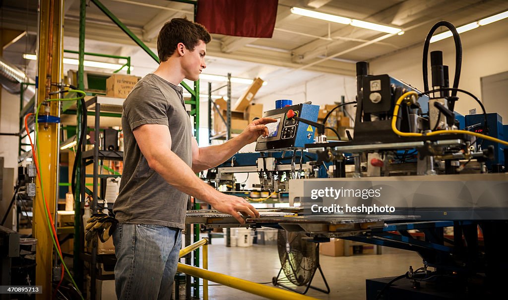 Worker Operating Machinery In Factory High-Res Stock Photo - Getty Images