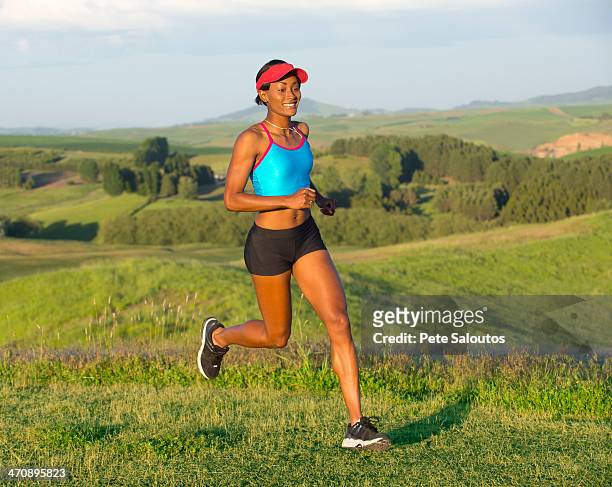 young woman running in landscape, othello, washington, usa - othello stock pictures, royalty-free photos & images